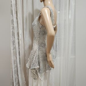 FIT-FLARED ASYMMETRIC MESH TOP BY ZARA